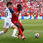 115242901-bosnia-herzegovinas-forward-20-esmir-bajraktarevic-l-fights-for-the-ball-with-canada